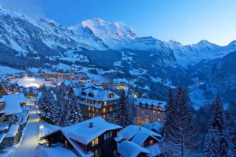 Magical winter evenings in the Swiss Alps surrounded by snow covered villages and peaks
