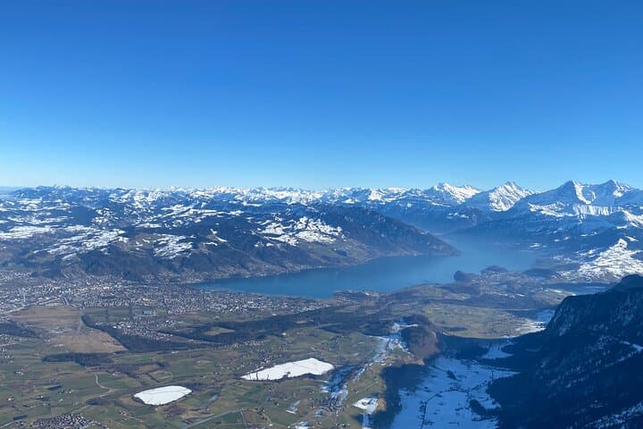The experience of flying by helicopter to the Bernese Oberland is unique. The view of Lake Thun and the white Alps behind is very beautiful.