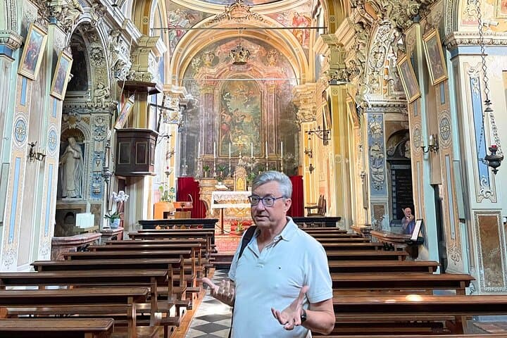 Exploring the beautiful, baroque Church of St. Vigilio with the guide