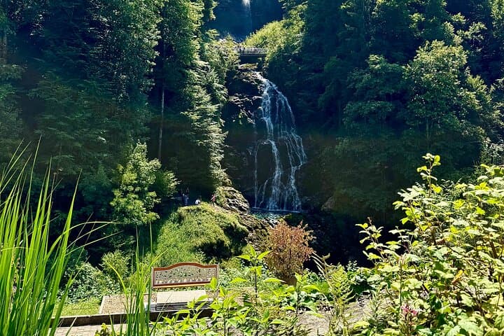 Walking along scenic paths and viewpoints at the Giessbach Falls.