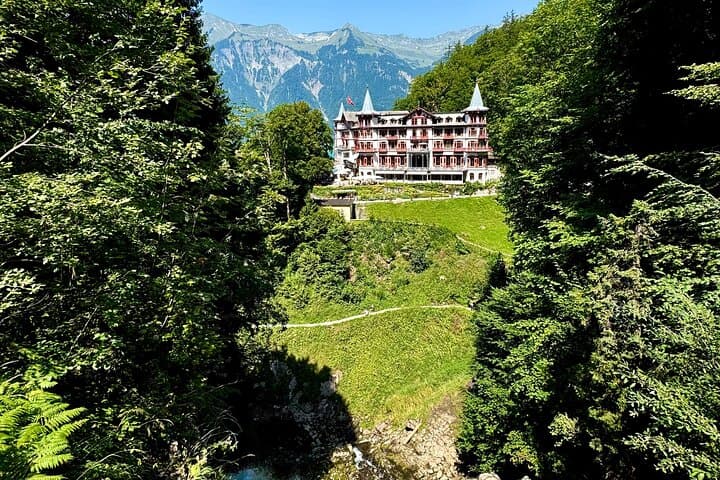 A beautiful view of the Grandhotel Giessbach overlooking Lake Brienz.