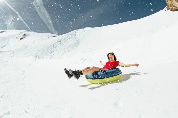 Explore the mystical ice caves and glide over deep crevasses on the Ice Flyer chairlift