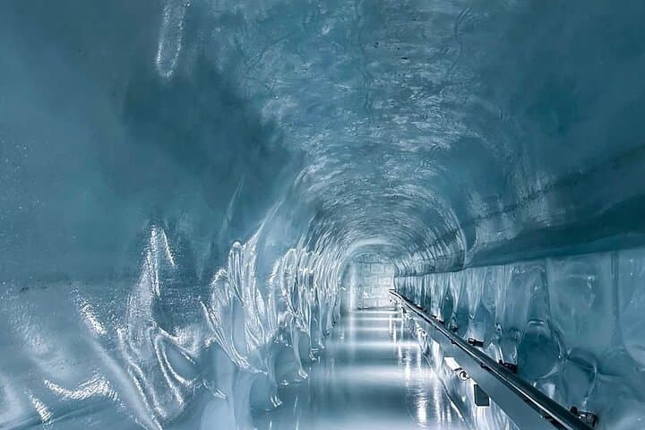 Walk through a magical glacier cave deep inside the Swiss Alps