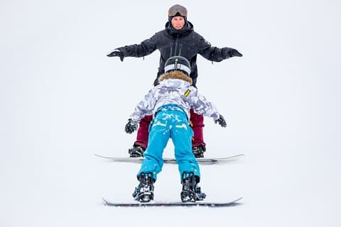 Sign up your kids for a half-day snowboard lesson to improve their confidence and ability.
