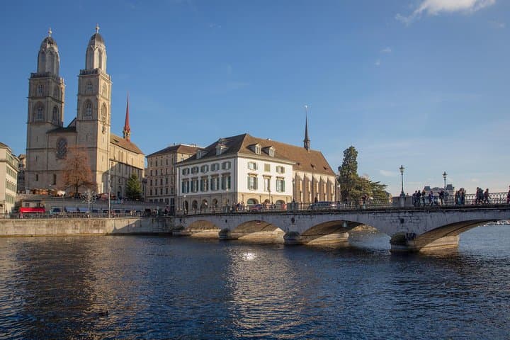 Historic Munsterbruke bridge hangs over the Limmat in central Zurich.