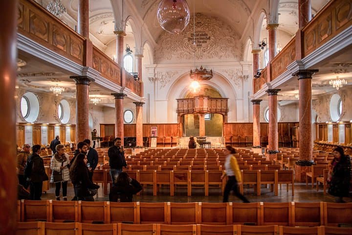 Visitors explore St. Peter Pfarrhaus, the church founded in 1000AD, in Zurich, Switzerland.