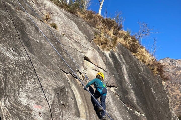 Family rock climbing near Locarno