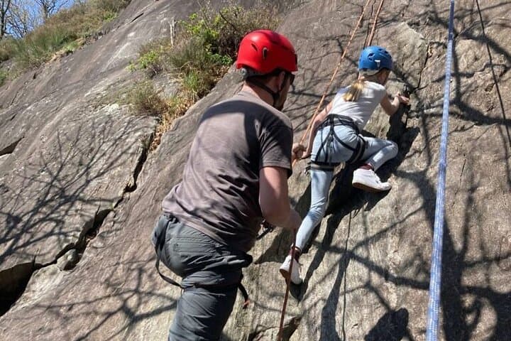 Family rock climbing near Locarno