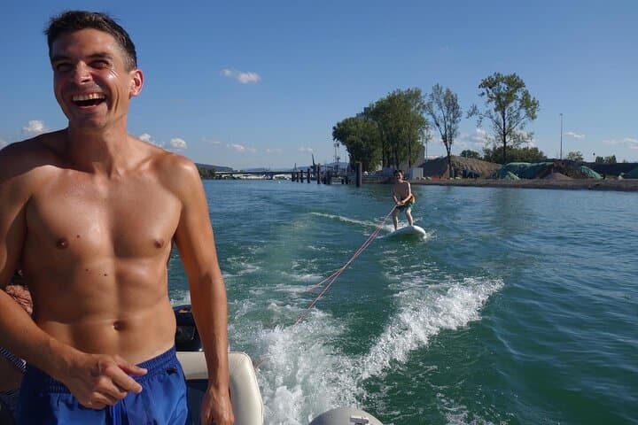 Hydrofoil and surfing on the Rhine behind a motorboat