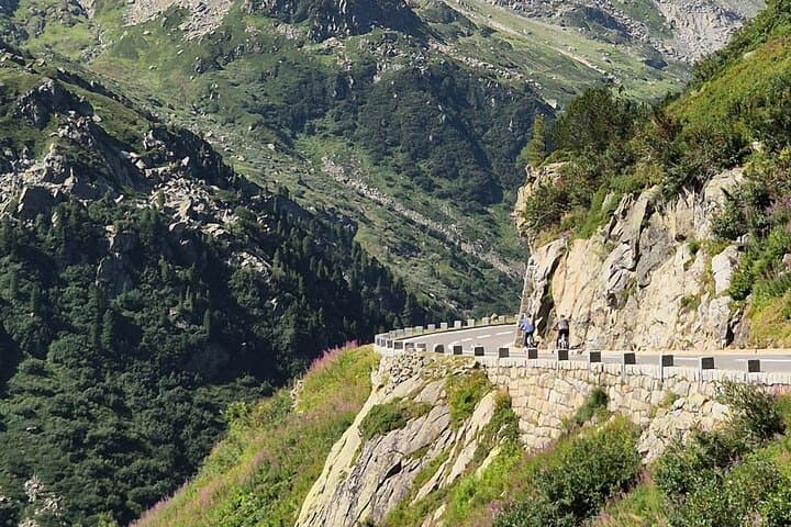 Alpine Pass Descent: Downhill Cycling Adventure in the Swiss Alps