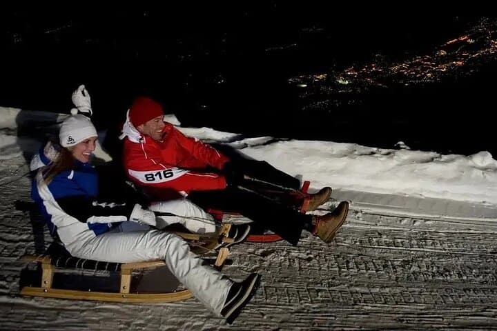Interlaken: Sunset Sledding Adventure & Swiss Cheese Fondue