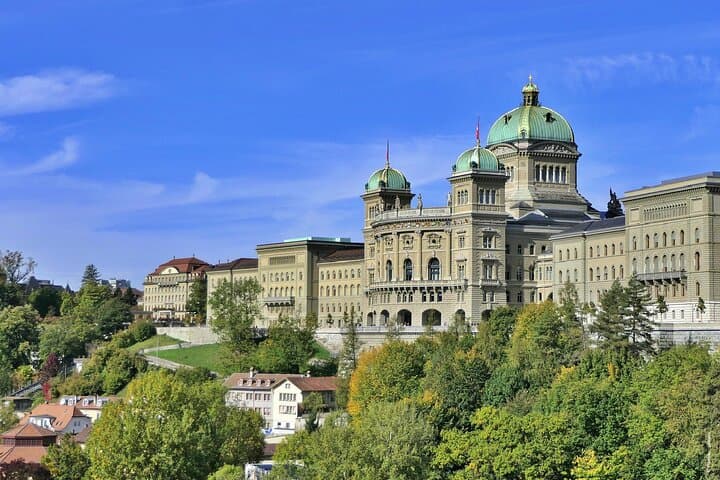 Federal Palace: The seat of the Swiss government and its iconic dome.