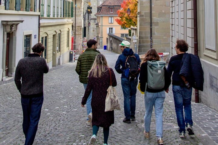 Small group of visitors, descending into the quiet street of the city.