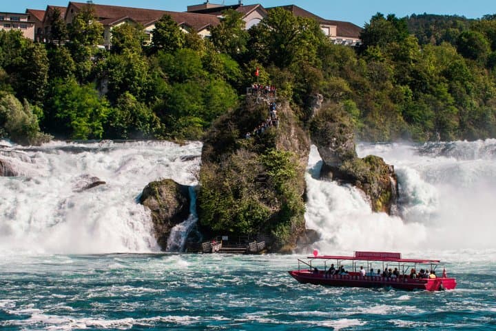 From Zurich Rhine Falls Tour with Boat Ride and Hotel Pickup